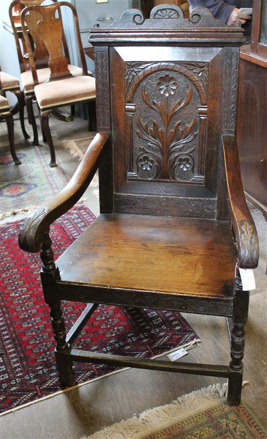 Carved oak panelled-back chair